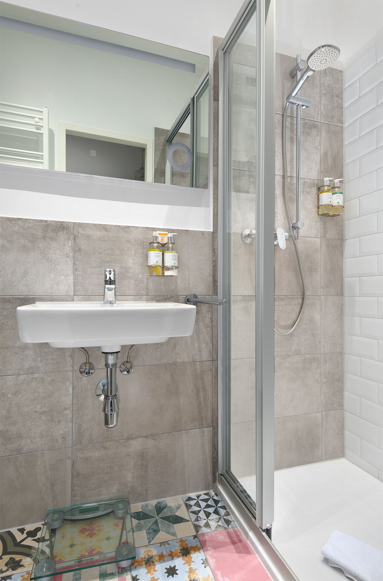 junior suite | bathroom | shower, free toiletries, hair dryer, dressing gowns