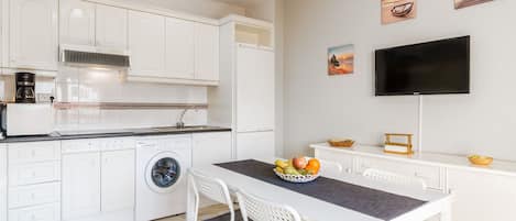 Fridge, microwave, stovetop, coffee/tea maker