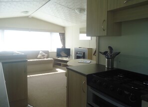 Caravan (Resort Plus) | Living area | Flat-screen TV - Mounts Bay Caravan Park (Marazion)