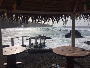 Private beach, black sand, sun-loungers, beach umbrellas