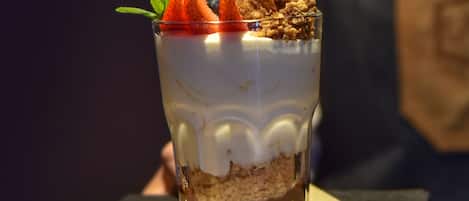 A layered dessert in a clear glass.