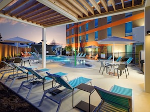 Seasonal outdoor pool, open 11:00 AM to 8:00 PM, pool umbrellas