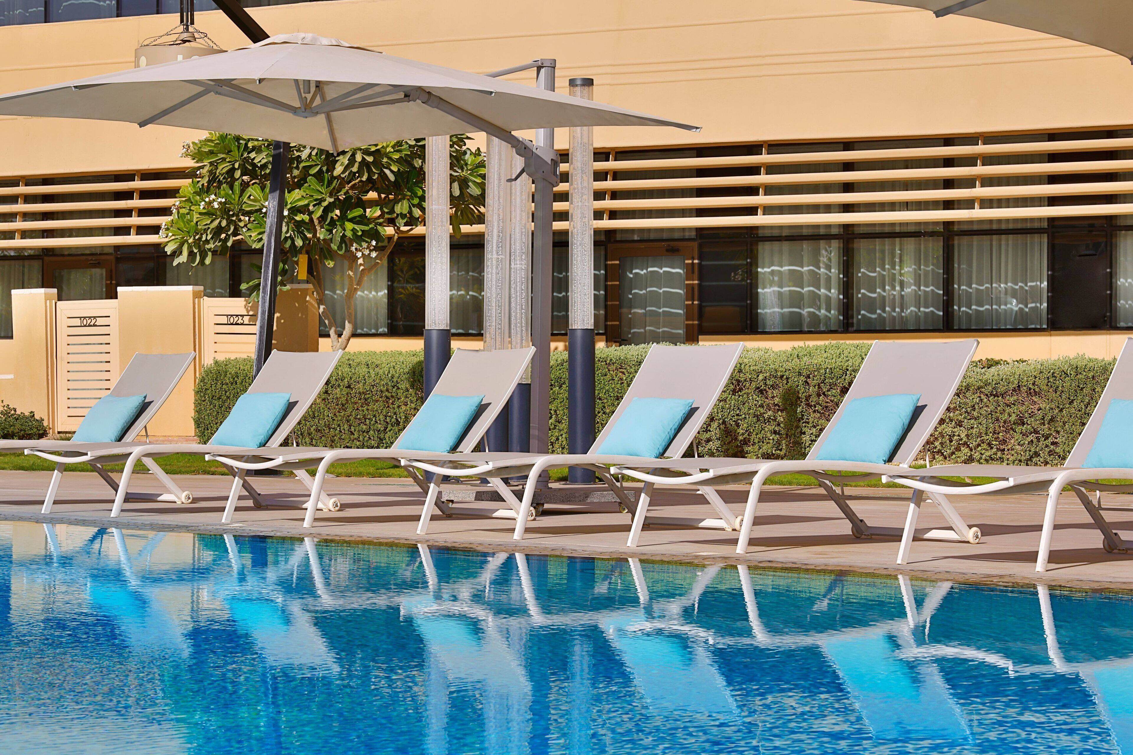 Outdoor pool, open 6:00 AM to 6:00 PM, pool umbrellas, sun loungers