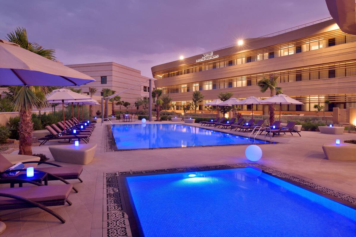 outdoor pool, open 6:00 am to 6:00 pm, pool umbrellas, pool loungers