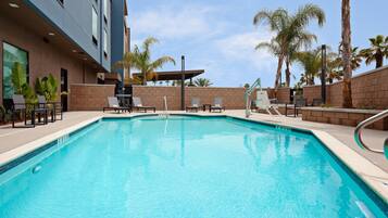 Outdoor pool, open 8:00 AM to 10:00 PM, pool umbrellas, sun loungers