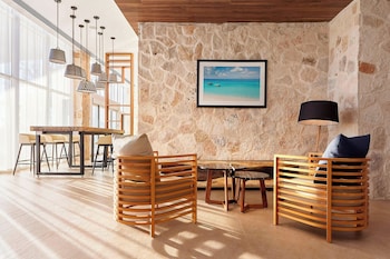 Hotel entrance and lobby at Fairfield Inn & Suites by Marriott Cancun Airport