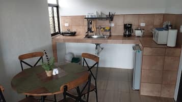 Fridge, coffee/tea maker, cookware/dishes/utensils