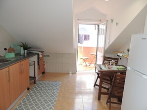 Fridge, microwave, stovetop, coffee/tea maker