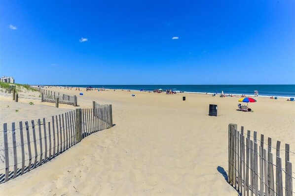 Relax on the beach with comfortable seating and scenic views.