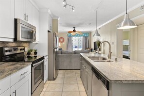 Enjoy cooking in this well-equipped kitchen with a microwave, stainless steel oven, and dishwasher.