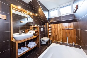 Combined shower/tub, hair dryer, towels, soap