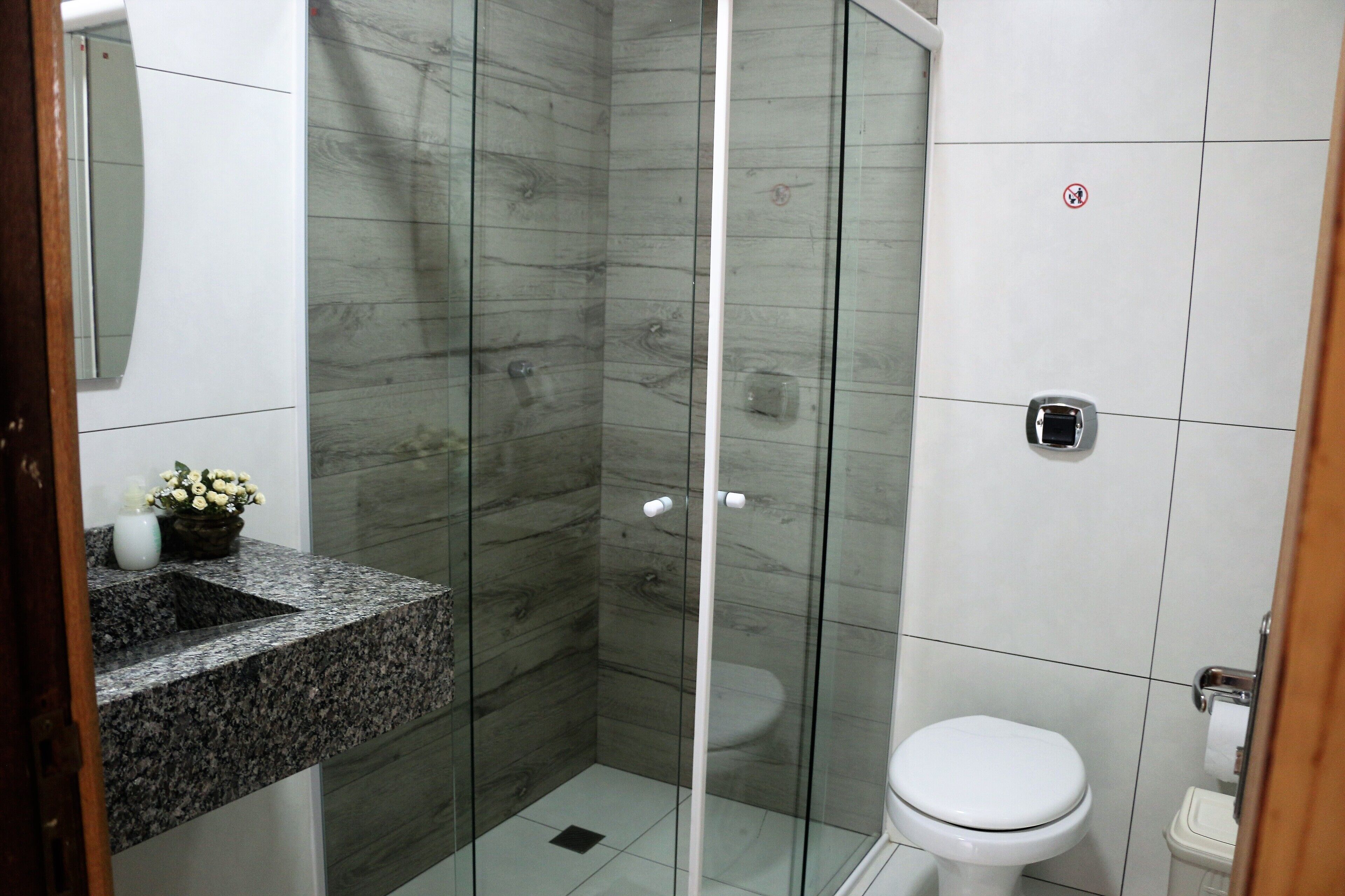 Shower, hair dryer, towels, toilet paper