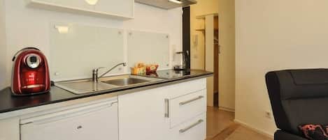 Fridge, coffee/tea maker, toaster, cookware/dishes/utensils