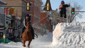 A horse and rider in motion, a person on skis, and a snow-covered area with a sign. - 1BR Cozy Downtown Studio Condo: Hiking Nearby (Leadville)