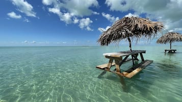 On the beach, sun-loungers, beach towels