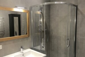 Shower, hair dryer, slippers, towels