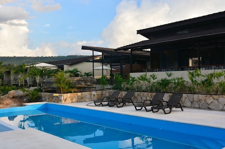 Outdoor pool, open 8:00 AM to 7:00 PM, pool loungers. Gyrola Birding Hotel Boutique & Spa