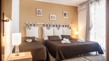 2 chambres, coffres-forts dans les chambres, fer et planche à repasser