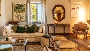 A cozy living room with a sofa, armchairs, a coffee table, and a fireplace. - VILLA SIENA is 4 km from Siena 10PAX AC, POOL & SPA total privacy. (Siena)