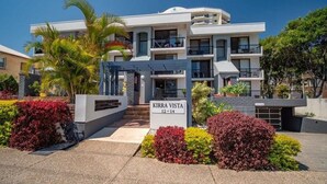 A modern building with a sign reading "KIRRA VISTA 12-14".