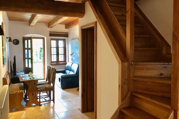 Fully renovated living room with direct access to porch and property yard.