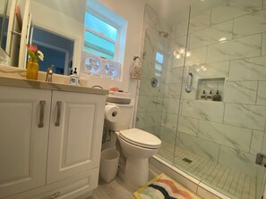 Shower, hair dryer, towels, soap