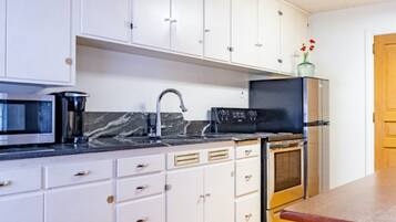 Fridge, microwave, oven, cookware/dishes/utensils