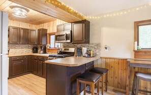 Fridge, microwave, oven, stovetop - Moose Lodge Log Cabin and Chalet w/ Hot Tub sleeps 16 (Anchorage)