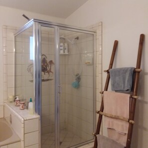 Shower, jetted tub, towels, soap