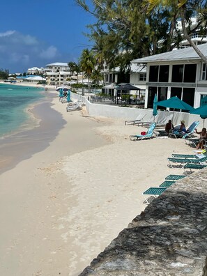 On the beach, sun loungers, beach towels