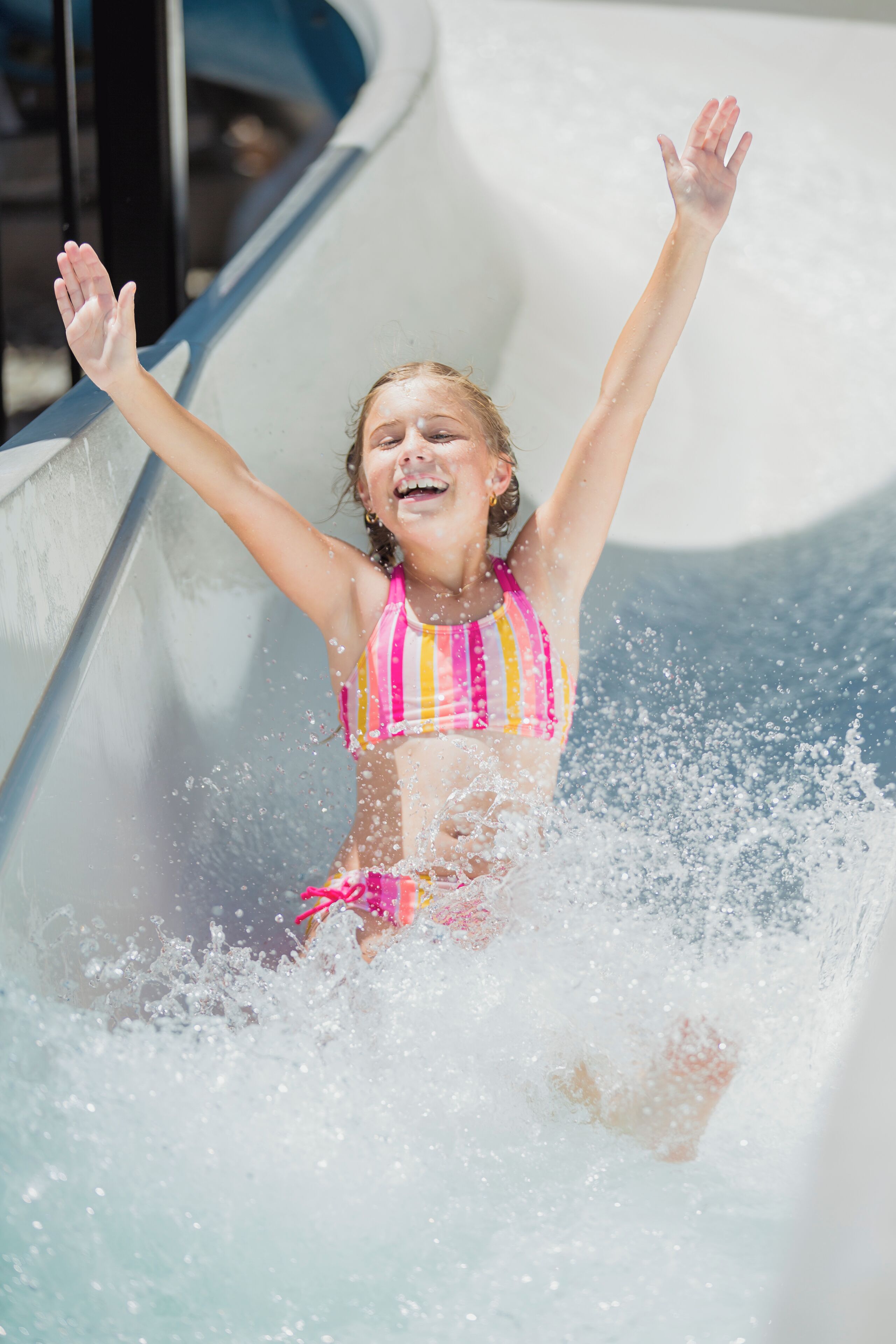 A person sliding down a water slide.
