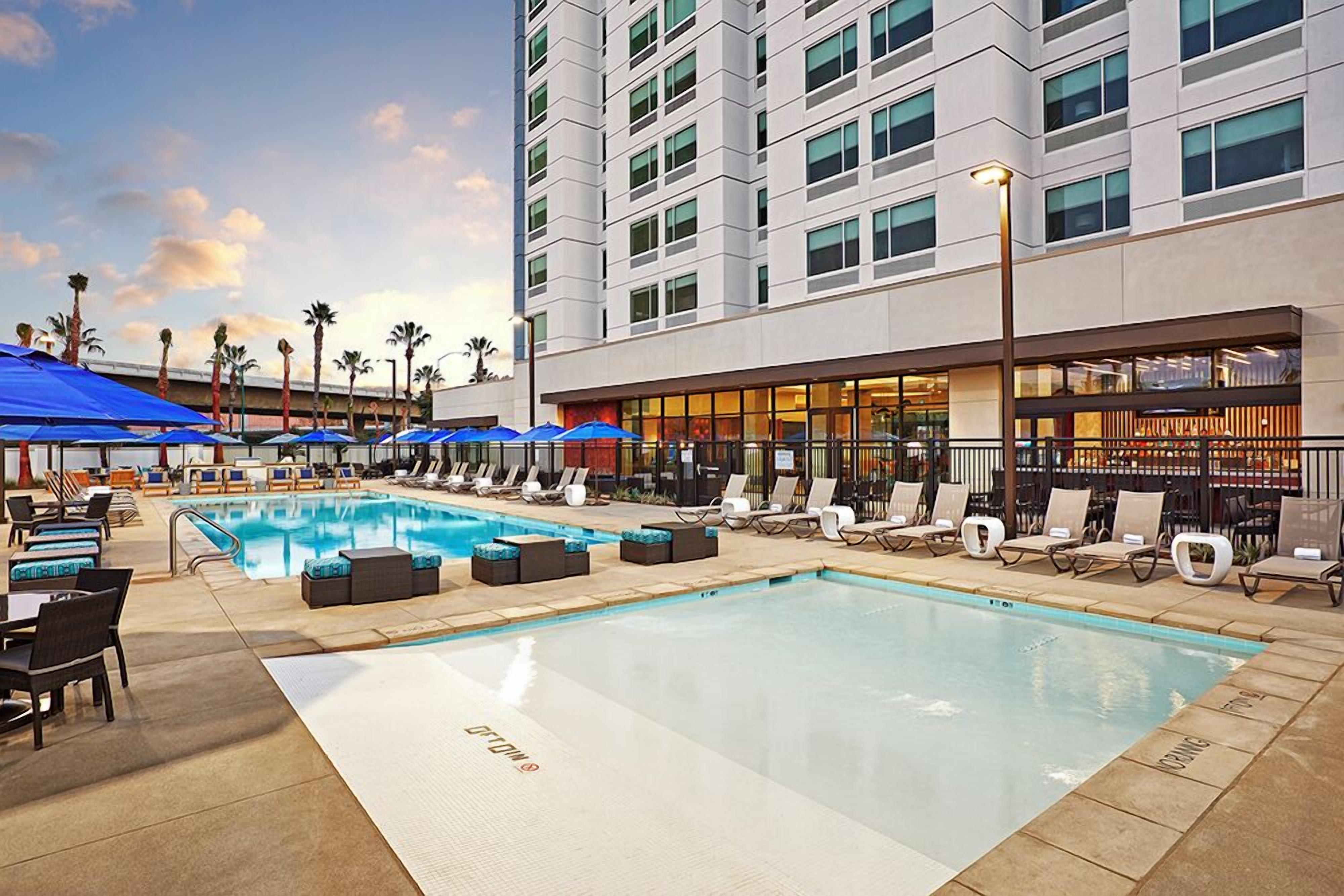 2 outdoor pools, open 10:00 AM to 9:00 PM, pool umbrellas, sun loungers