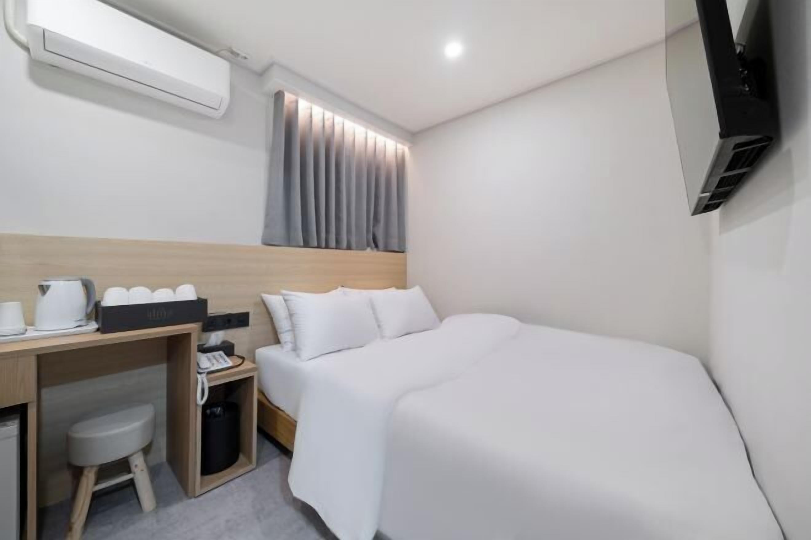 Down duvets, memory-foam beds, desk, laptop workspace