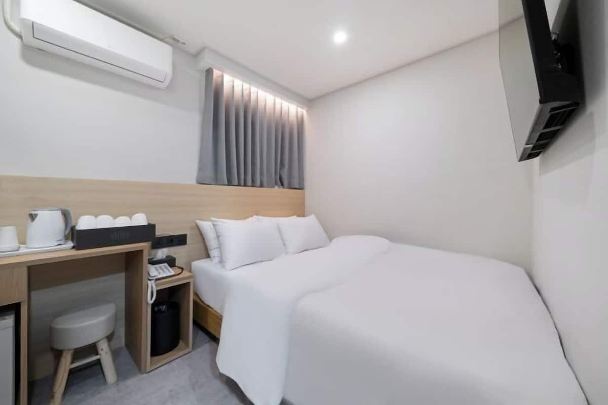 Down comforters, memory foam beds, desk, laptop workspace