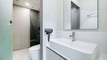 Family Room, 2 Queen Beds, Non-Smoking, City View, No Parking, Check-in after 8 PM | Bathroom | Hair dryer, bathrobes, slippers, towels