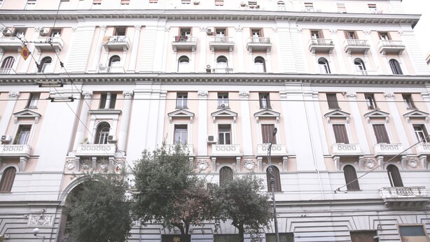 A multi-story building with classical architecture, featuring balconies, arched windows, and decorative moldings. - B&B La Baia Di Partenope (Naples)