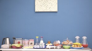 A kitchen counter with various food items and kitchenware. - B&B La Baia Di Partenope (Naples)