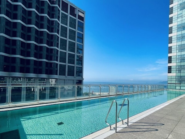 Seasonal outdoor pool, open 10:00 AM to 7:00 PM, sun loungers