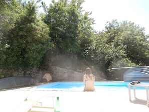 Seasonal outdoor pool, pool loungers