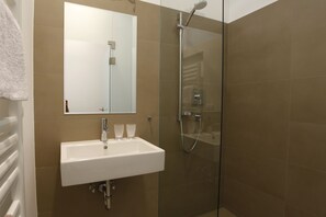 Bathtub, hair dryer, towels, soap