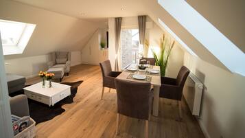 Apartment, 1 Bedroom, Balcony, Garden View | Living room | Flat-screen TV