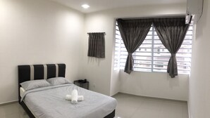 A bedroom with a bed, a nightstand, a window with curtains, and a ceiling fan. - De Little Cabin near Sunway Lost World of Tambun Ipoh, Perak Malaysia. (Ipoh)