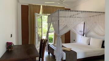 Deluxe Triple Room, Non Smoking, Garden View | 1 bedroom, individually furnished, desk, blackout curtains