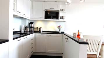 Studio, Non Smoking | Private kitchen | Full-sized fridge, microwave, stovetop, dishwasher