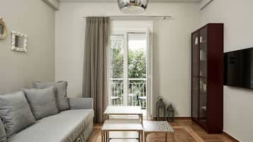 Basic Apartment, 1 Bedroom | Living room | 42-inch flat-screen TV with satellite channels, Smart TV