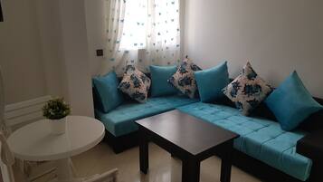 Superior Apartment | Living area | Flat-screen TV
