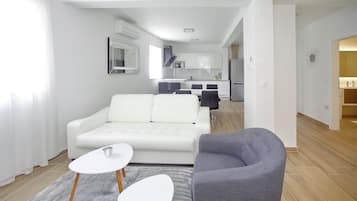 Luxury Apartment (1 Bedroom) | Living area | Flat-screen TV