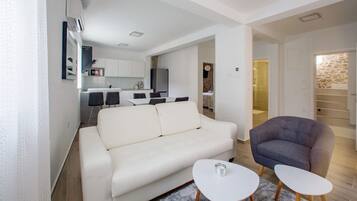 Luxury Apartment (1 Bedroom) | Living area | Flat-screen TV
