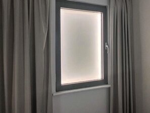 Blackout drapes, soundproofing, travel crib, free WiFi
