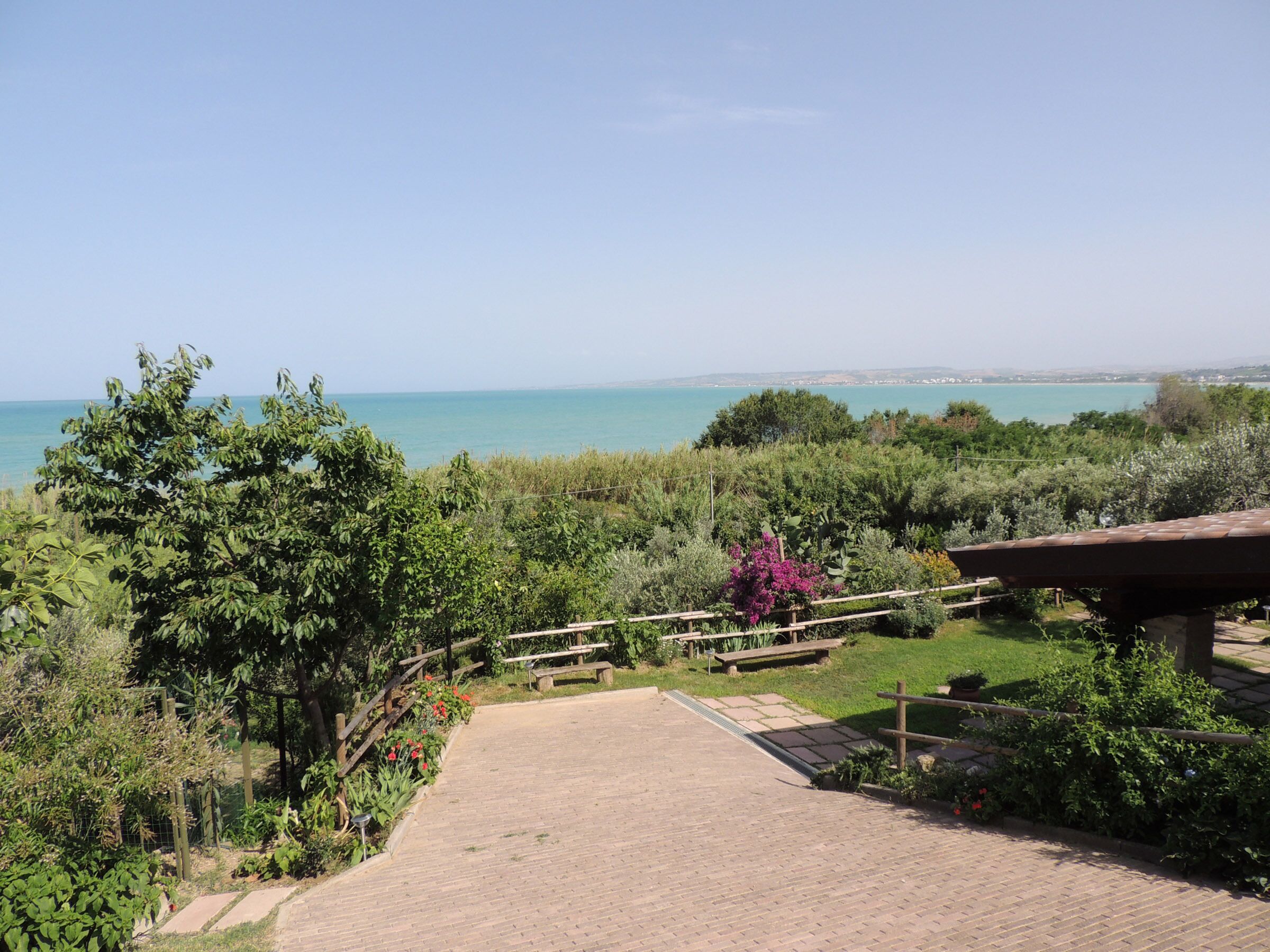 Private house with porch and garden, just steps from the beach